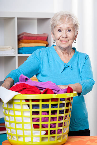 istock Elderdly lady with washing 478695613