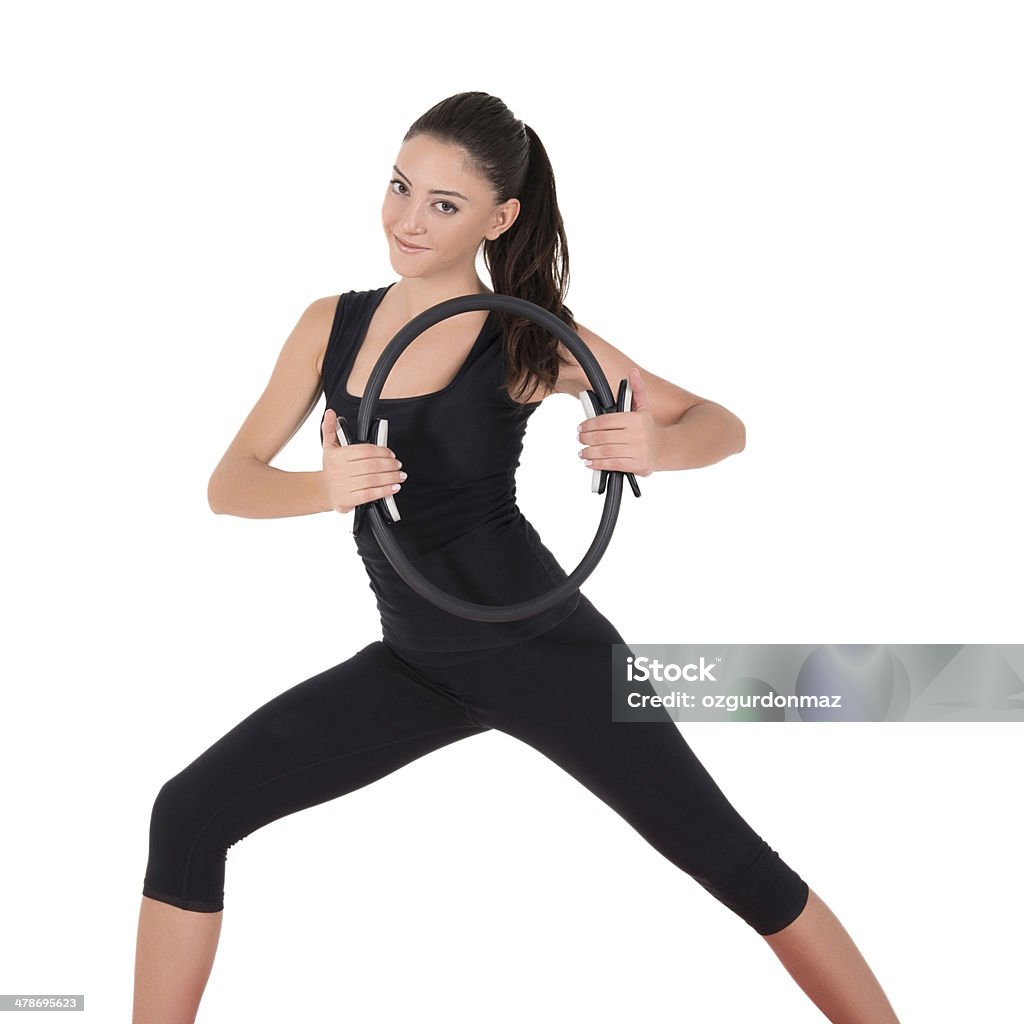 Mujer joven haciendo ejercicios de fitness - Foto de stock de Actividades y técnicas de relajación libre de derechos