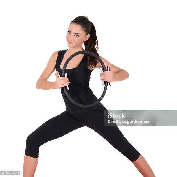 Mujer Joven Haciendo Ejercicios De Fitness Foto de stock y más banco de imágenes de Actividades y técnicas de relajación - Actividades y técnicas de relajación, Adulto, Adulto joven