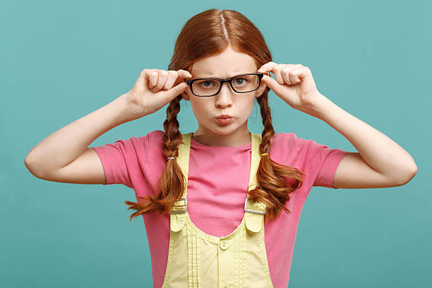istock Little girl touching her glasses 478698958