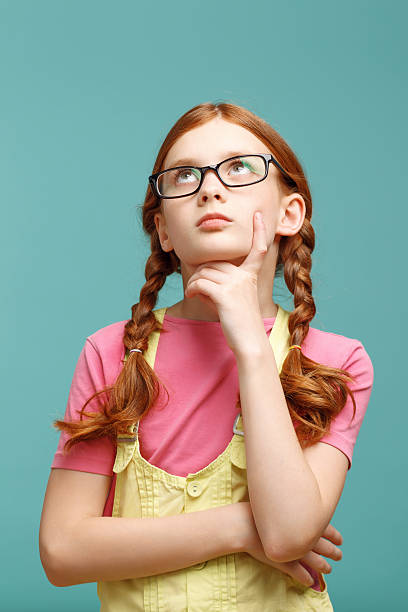 istock Nice girl in glasses thinking 478698996