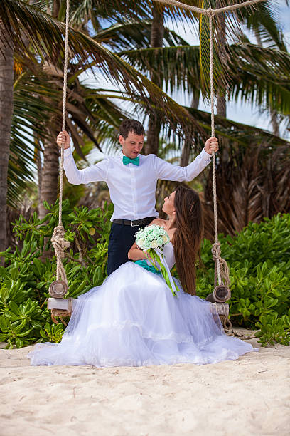 istock Young loving couple on the swing 478699198
