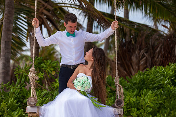 istock Young loving couple on the swing 478699200