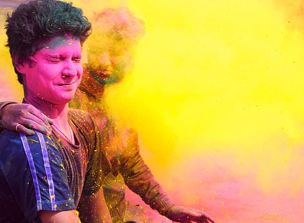 istock Indian People playing with colorful gulal on Holi. 478702057