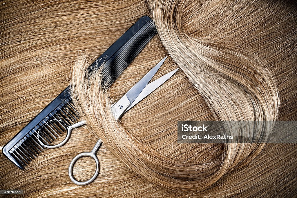 hairdressing professional hairdresser scissors and comb on hair background Scissors Stock Photo