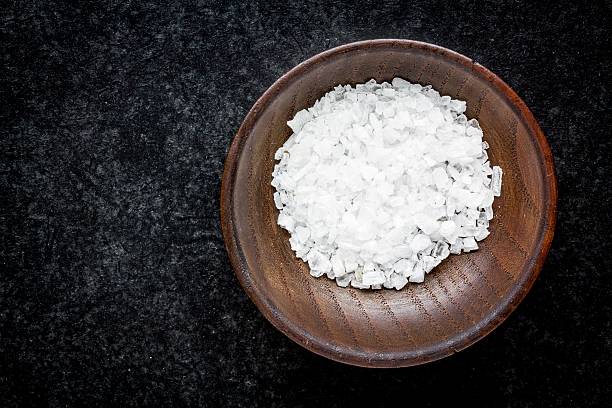 istock sea salt in a wooden bowl 478702726