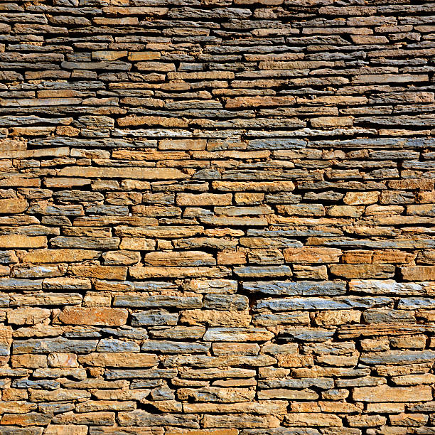 Stone wall Old stone wall roughhewn stock pictures, royalty-free photos & images