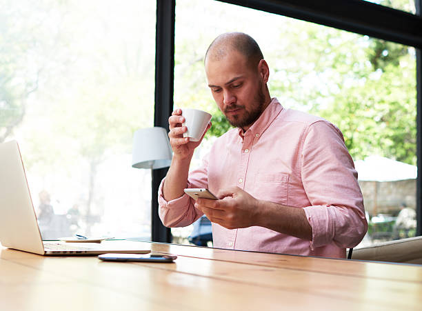 istock Modern business man connecting to wireless on his smart phone 478703946
