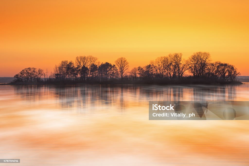 Sunrise over foggy lake in early spring 2015 Stock Photo