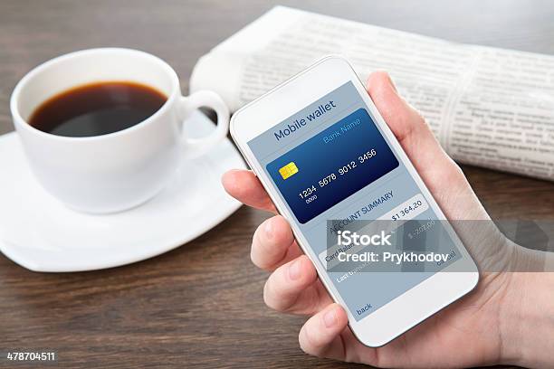 Businesswoman Hand Holding A Phone With Mobile Wallet Online Shopping Stock Photo - Download Image Now
