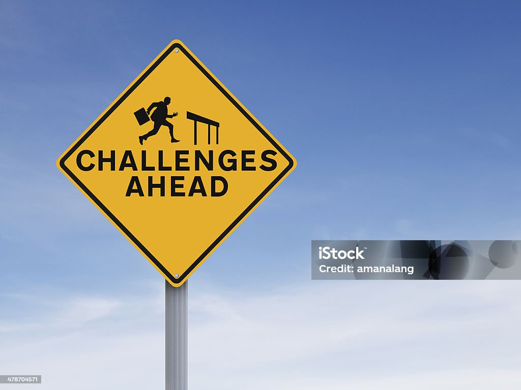 Challenges Ahead A conceptual road sign on challenges or obstacles Challenge Stock Photo