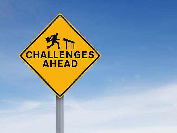 Challenges Ahead A conceptual road sign on challenges or obstacles hurdle stock pictures, royalty-free photos & images