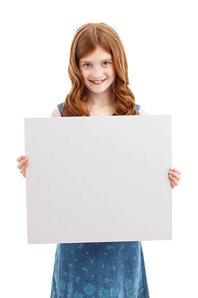 istock Positive girl holding white board 478707612