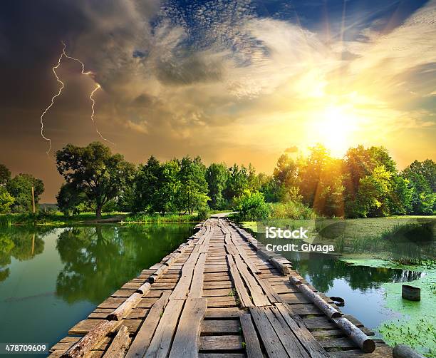 Lightning Over The Wooden Bridge Stock Photo - Download Image Now - Lightning, Bridge - Built Structure, Forest
