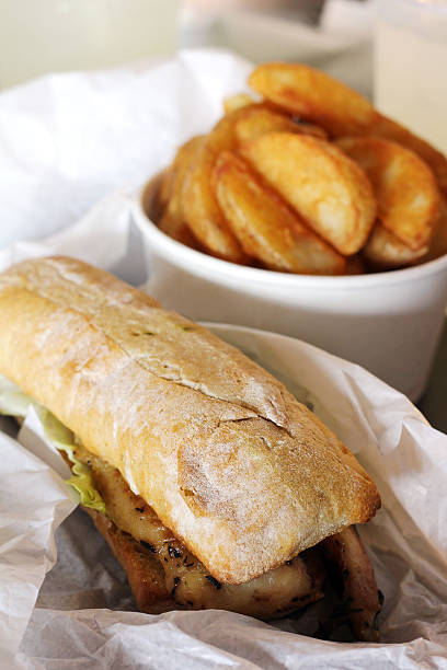 istock Fish Sandwich with potato wedges 478711077