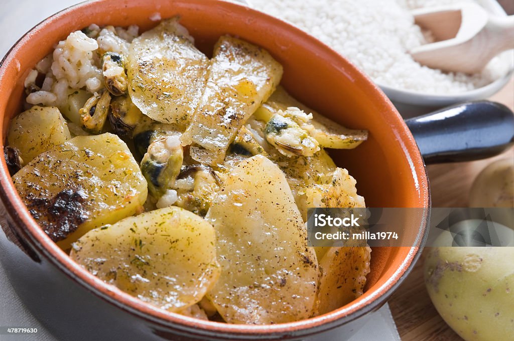 Tiella of potatoes, rice and mussels. 2015 Stock Photo