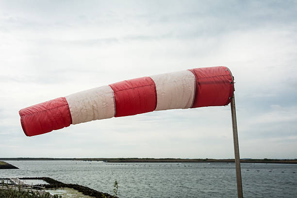 Windsock sideview straight into the storm  against overcast sky north sea in the backdrop
