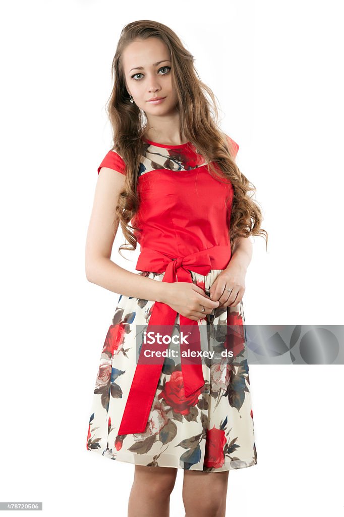 Pretty woman in red dress with flower ornament Pretty woman in red dress with flower ornament. Studioshot on white background 2015 Stock Photo