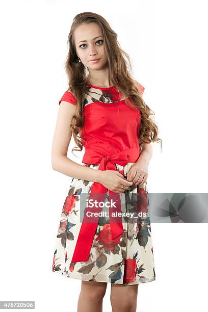 Pretty Woman In Red Dress With Flower Ornament Stock Photo - Download Image Now - 2015, Adult, Adults Only