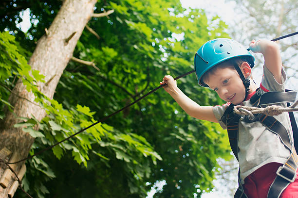 istock Five year boy on rope-way in forest 478723000
