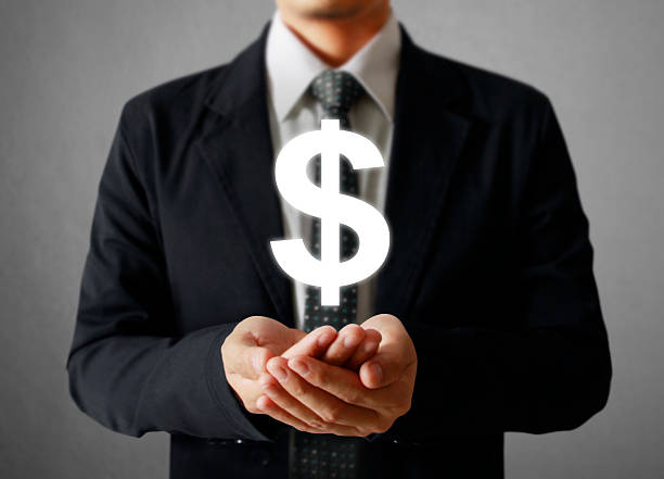 istock businessman with financial symbols 478723120