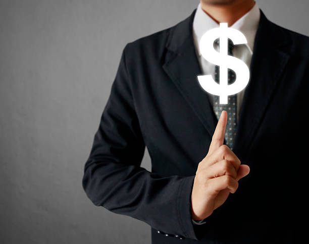 istock businessman with financial symbols 478723122