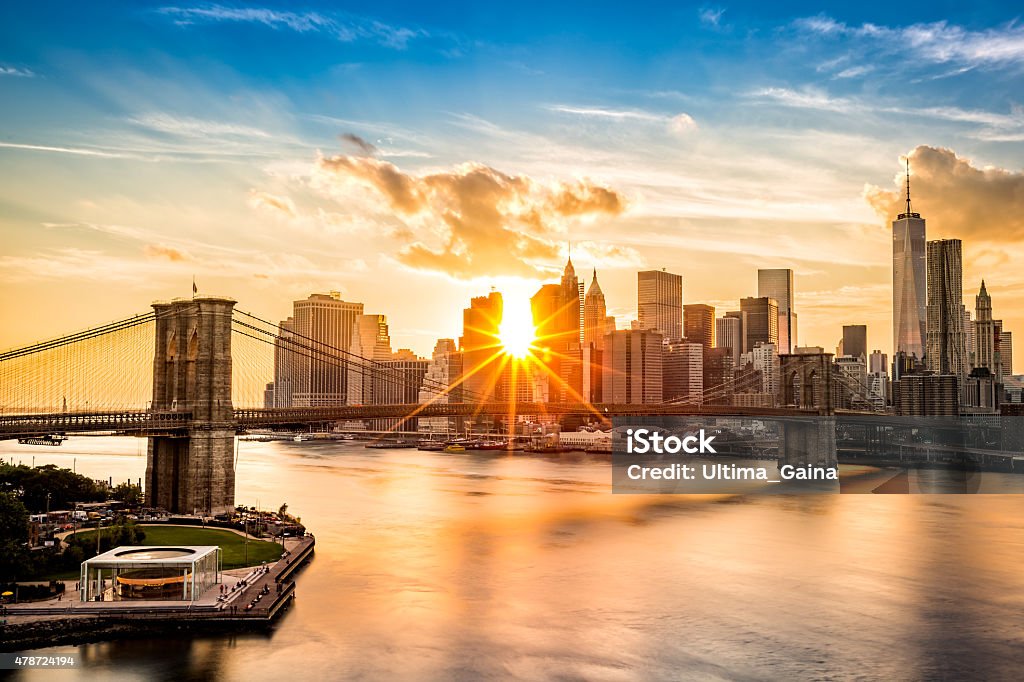 Brooklyn Bridge and the Lower Manhattan skyline at sunset Brooklyn Bridge and the Lower Manhattan skyline at sunset, as viewed from Manhattan Bridge New York City Stock Photo