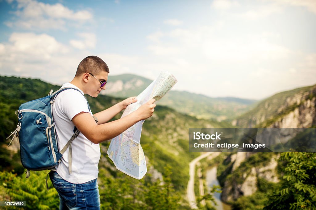 Tourist looking at map 2015 Stock Photo