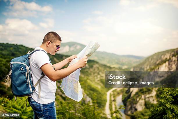 Tourist Looking At Map Stock Photo - Download Image Now - 2015, Achievement, Activity