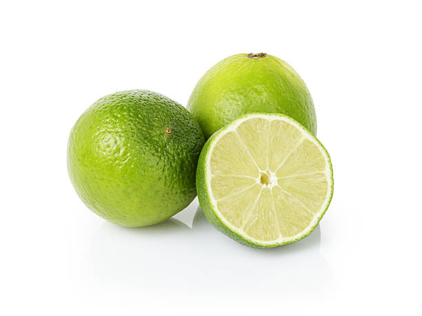 istock fresh lime fruits Isolated on white 478725004