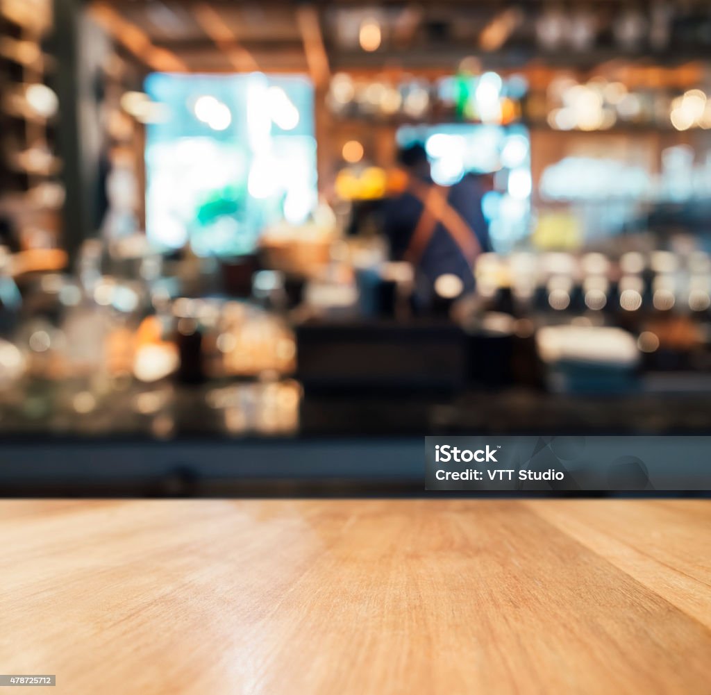 Table top counter with Blurred bar background Table top counter and Bartender with Blurred bar background Bar Counter Stock Photo