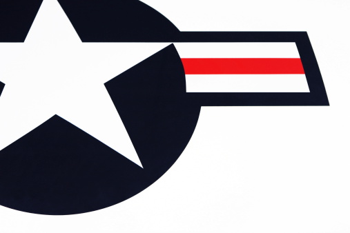 United States of America government insignia on side of Air Force One jet with large star on blue background and red white stripe with copy space.