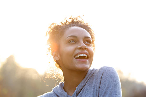 istock Attractive young woman laughing and looking up 478729002