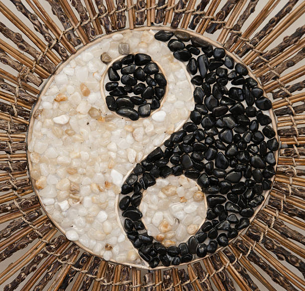 yin yang symbol made of pebble stones