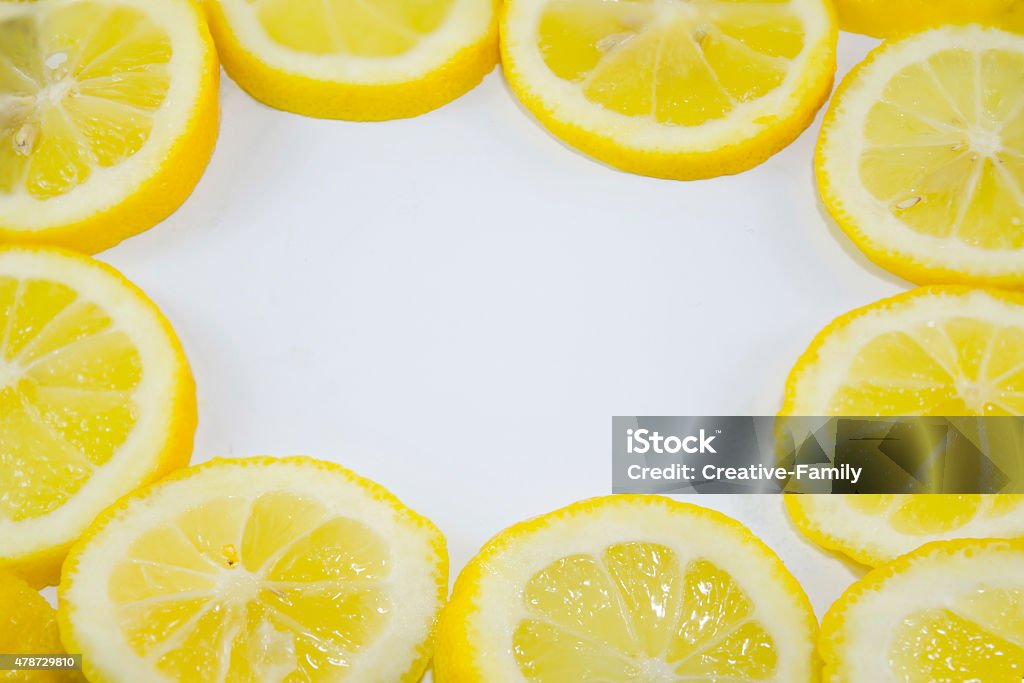 Lemon slices in a circle with copyspace Lemon slices in a circle with copyspace in the middle 2015 Stock Photo