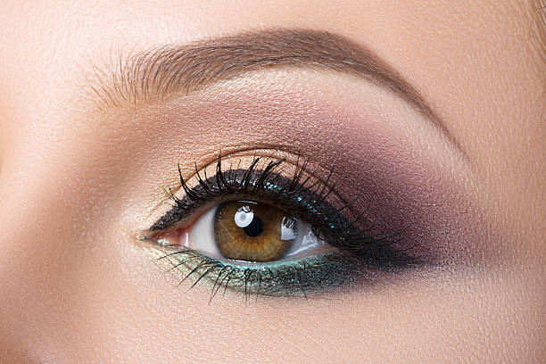 istock Close-up of woman's eye with creative modern make-up 478730096