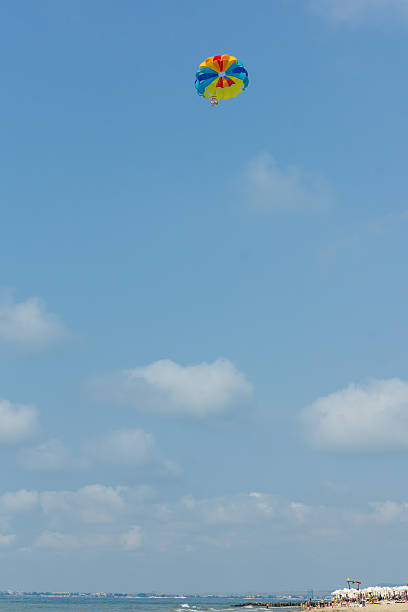 istock parachute in the sky over the sea 478731568