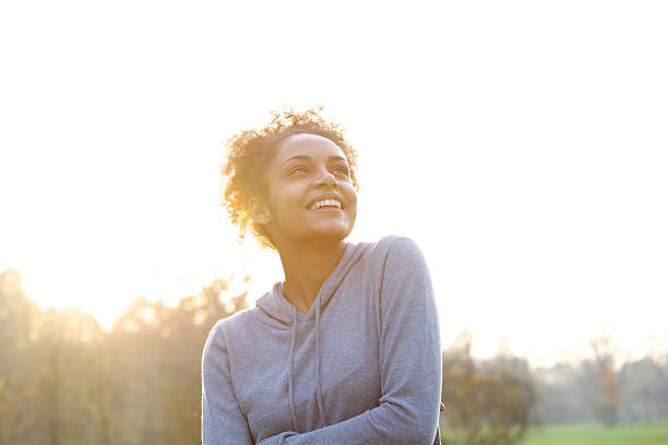 istock Happy young woman thinking and looking up 478732020