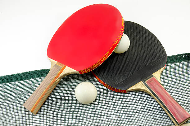 istock Two table tennis rackets and a net isolated 478732080