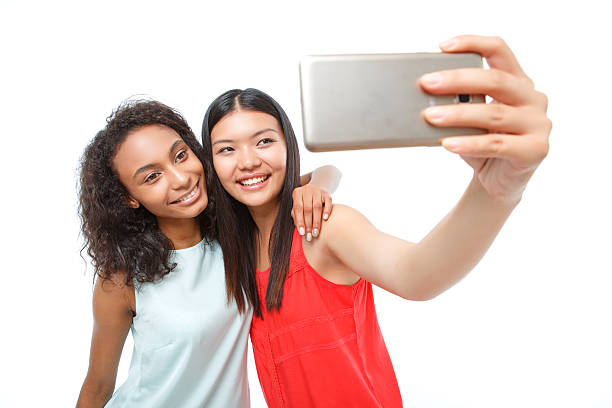istock Positive girls making photos 478732190