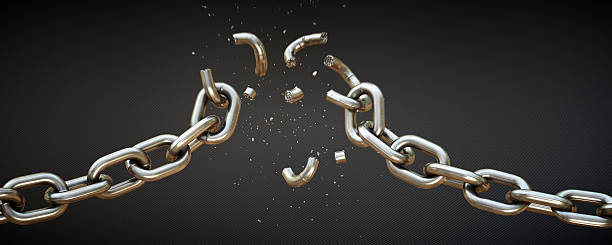 Broken Chain A11 This scene shows a chain falling apart under strain of force. The chains central links are breaking apart and many small fragments are blowing vertically out. The scene is isolated on a dark patterned background. fracture stock pictures, royalty-free photos & images