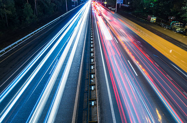istock Night traffic with blurred traces from cars 478734363