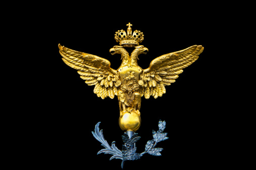 A varient of the Russian Coat of Arms featuring a golden crowned double headed eagle.  On the breast plate is Saint George slaying a dragon.  An important national symbol, found on the public gates of the Hermitage in St.Petersburg, Russia.
