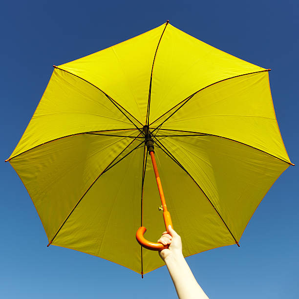 istock Yellow umbrella on the sky 478735492