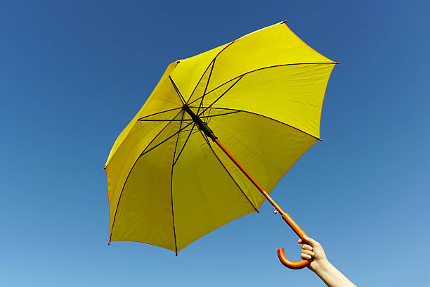 istock Yellow umbrella on the sky 478735502