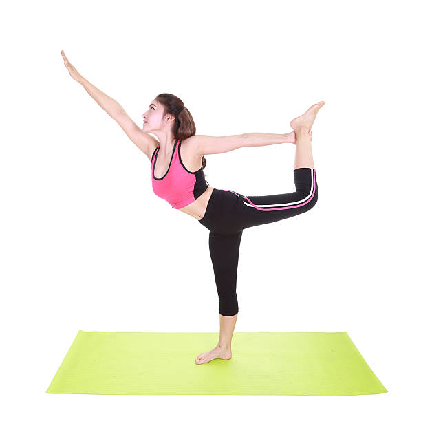 istock Young woman doing yoga exercise 478736520
