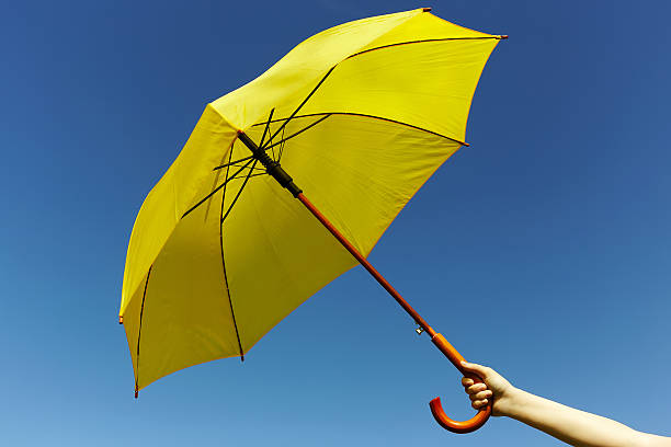 istock Yellow umbrella on the sky 478736790