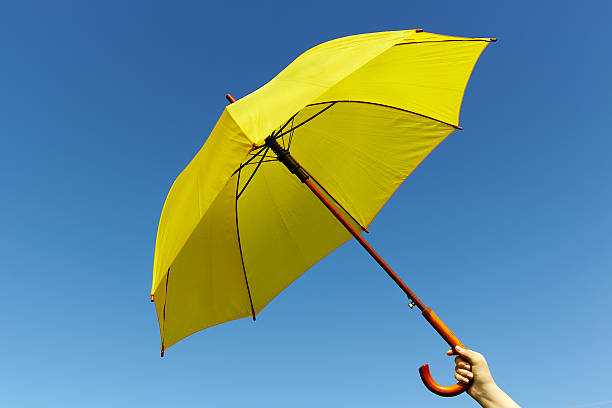 istock Yellow umbrella on the sky 478736796