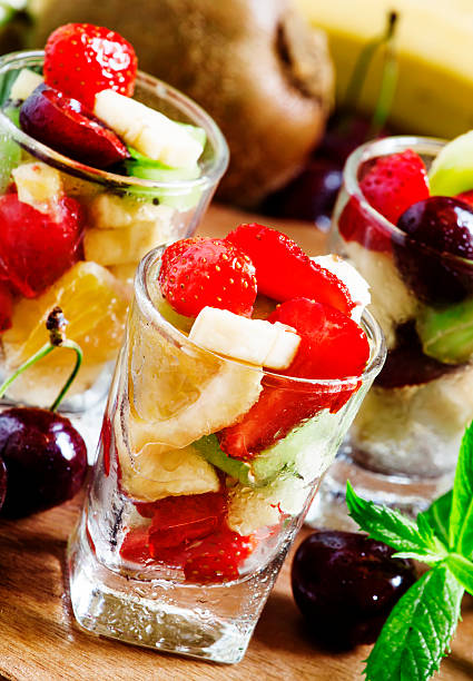 istock Salad from fruit and berries in glasses 478736932