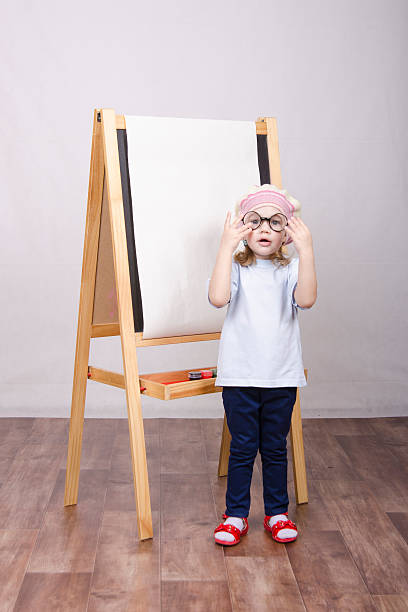 istock Girl artist paints on canvas 478738553
